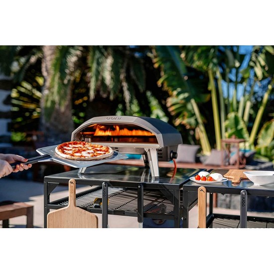 Pala forata per Pizza Ooni da 35.5cm mente toglie la pizza dal forno seconda foto